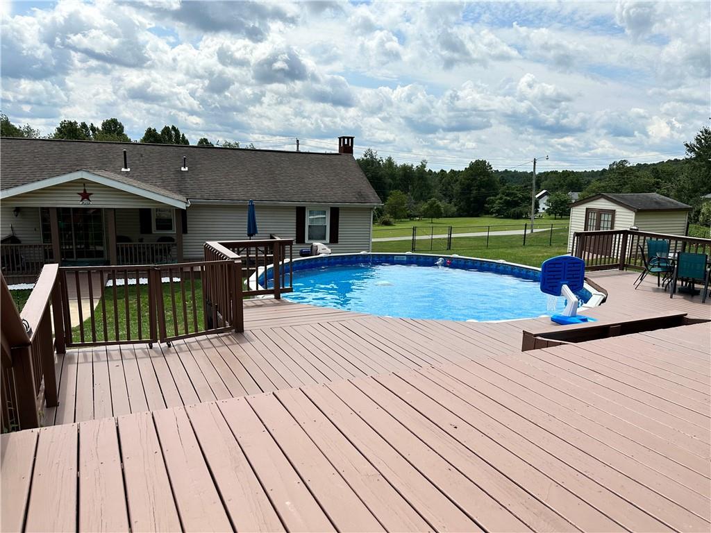 3021 Langley Road Uniontown, PA 15401 - Photo 22 of 28 a view of a chairs and table on the wooden deck