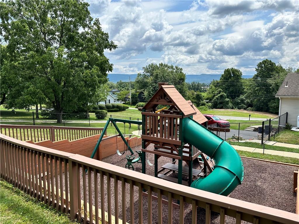 3021 Langley Road Uniontown, PA 15401 - Photo 24 of 28 a view of a deck with wooden floor barbeque oven and trees