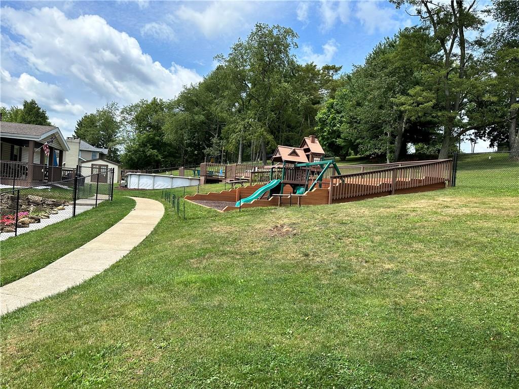 3021 Langley Road Uniontown, PA 15401 - Photo 26 of 28 a view of a swimming pool with a bench and trees around