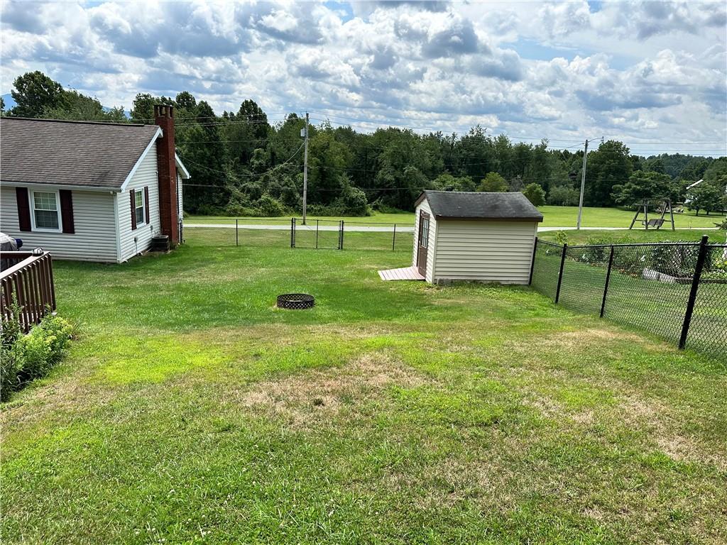 3021 Langley Road Uniontown, PA 15401 - Photo 27 of 28 a view of a house with a backyard