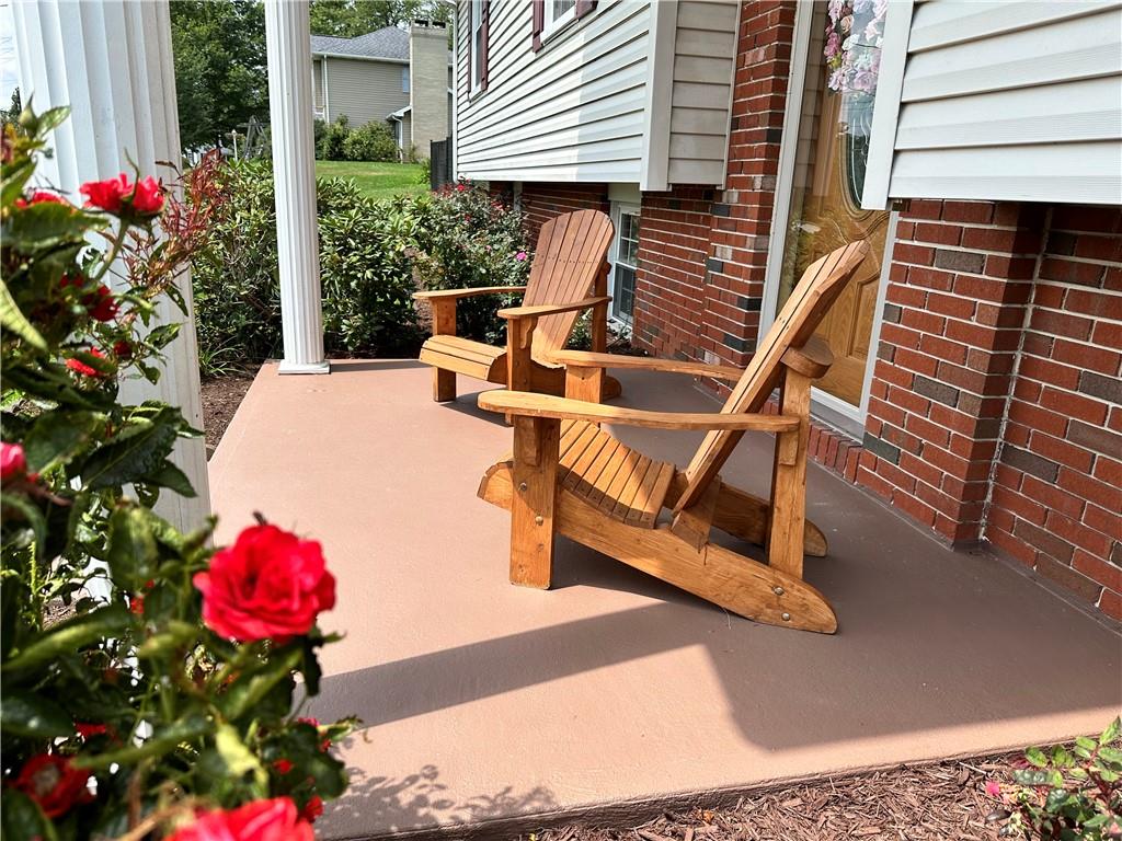 3021 Langley Road Uniontown, PA 15401 - Photo 4 of 28 a balcony with filled with furniture and flowers