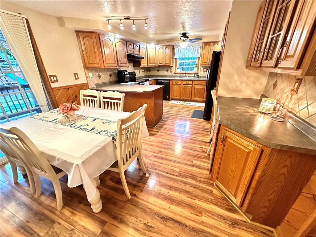 3021 Langley Road Uniontown, PA 15401 - Photo 6 of 28 a view of a dining room with furniture a rug and wooden floor