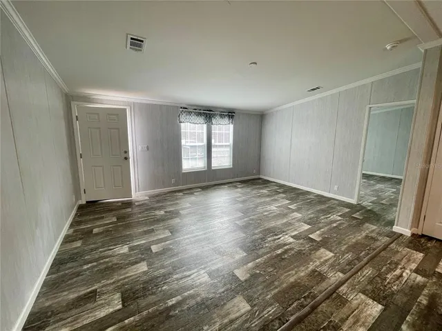 a view of an empty room and window