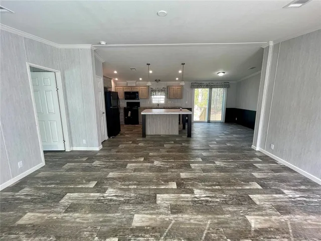 a view of kitchen and dining room with wooden floor
