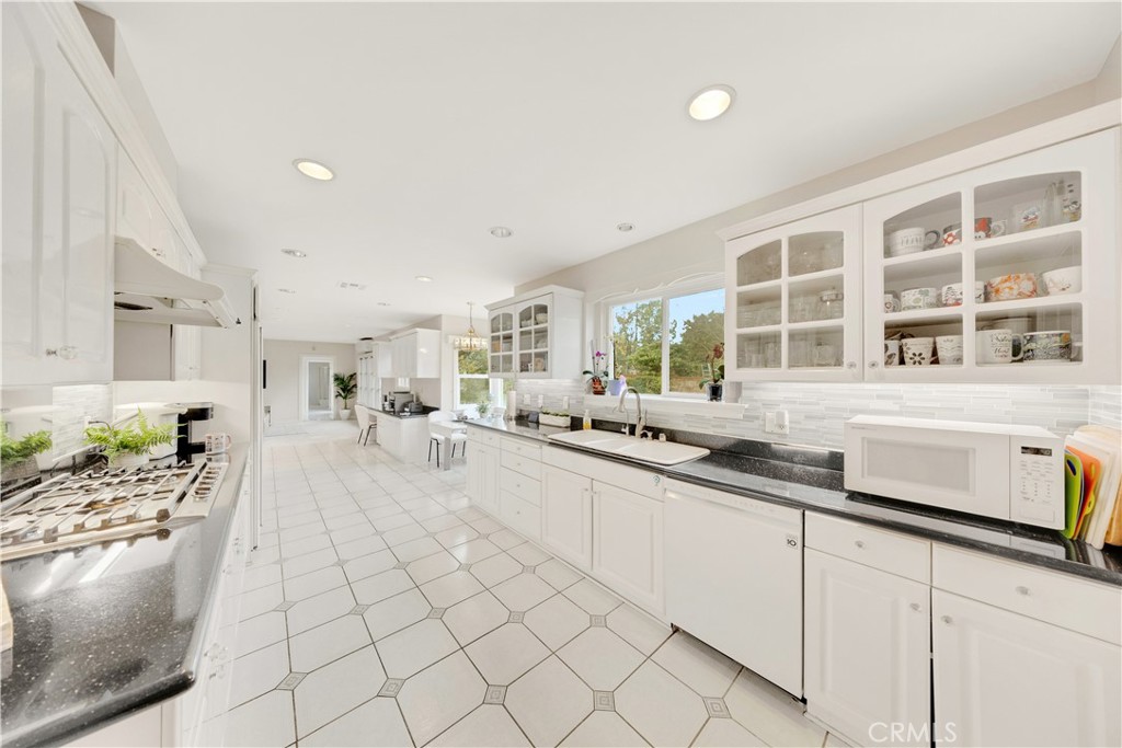 2835 Devonport Road San Marino, CA 91108 - Photo 15 of 54 a large white kitchen with cabinets