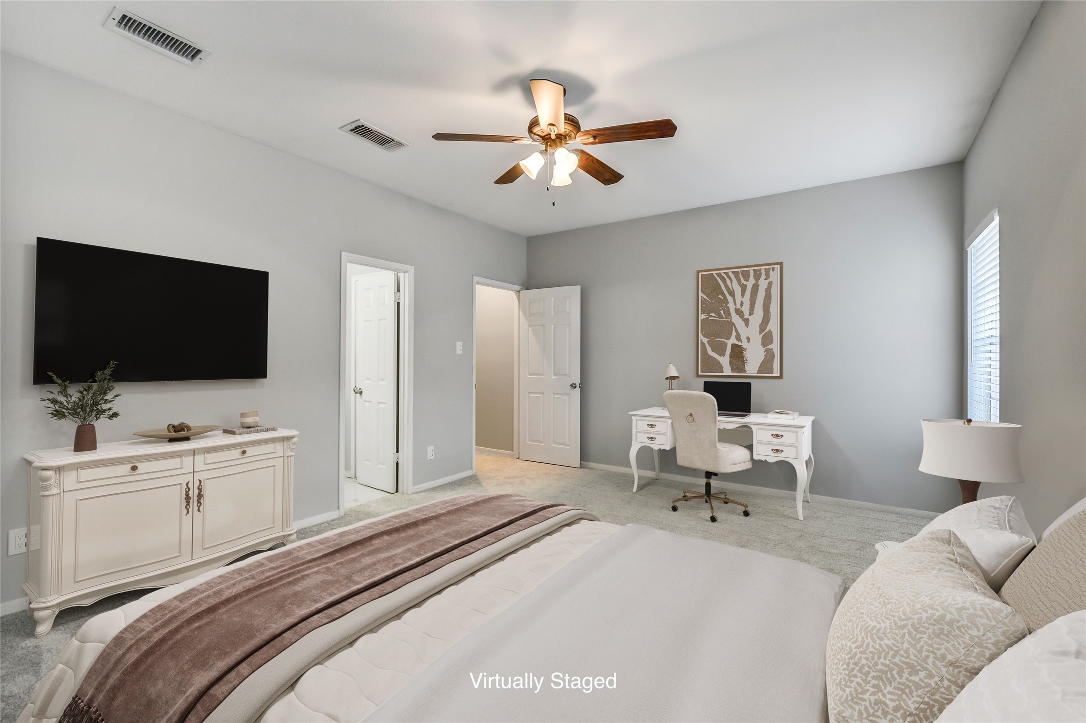 4001 Tanglewilde Street, Unit 1402 Houston, TX 77063 - Photo 17 of 23 Step into a serene secondary bedroom featuring seamless access to the hallway and a private bath, offering comfort and convenience in one inviting space.