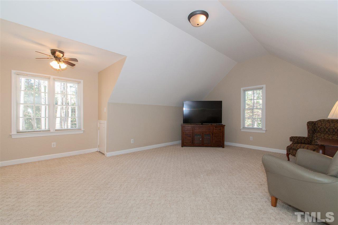 200 Release Circle Raleigh, NC 27615 - Photo 12 of 25 a living room with furniture and a flat screen tv