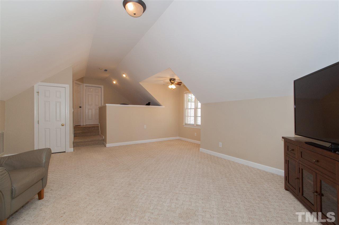 200 Release Circle Raleigh, NC 27615 - Photo 13 of 25 a view of a livingroom with furniture and a flat screen tv