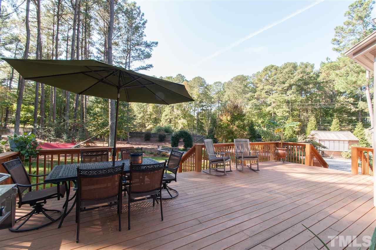 200 Release Circle Raleigh, NC 27615 - Photo 15 of 25 an outdoor space with furniture and umbrella