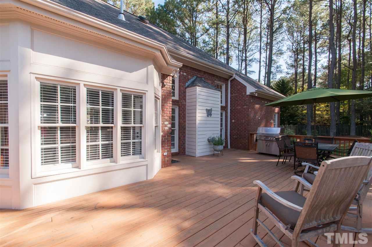 200 Release Circle Raleigh, NC 27615 - Photo 16 of 25 a view of backyard with outdoor seating and large trees