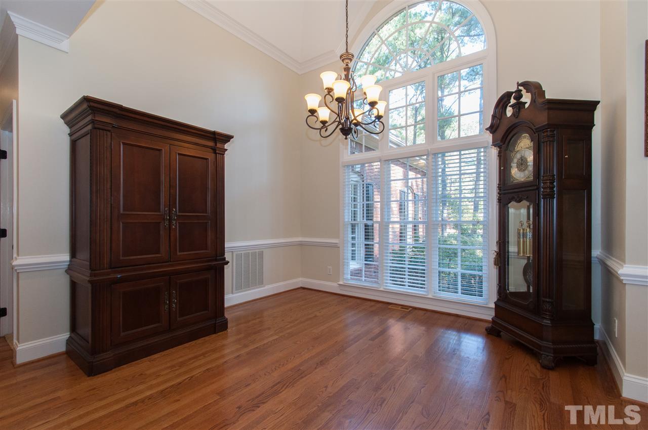 200 Release Circle Raleigh, NC 27615 - Photo 4 of 25 wooden floor in an empty room with a window