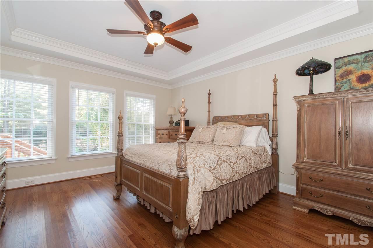 200 Release Circle Raleigh, NC 27615 - Photo 9 of 25 a bed sitting in a spacious bedroom next to a window