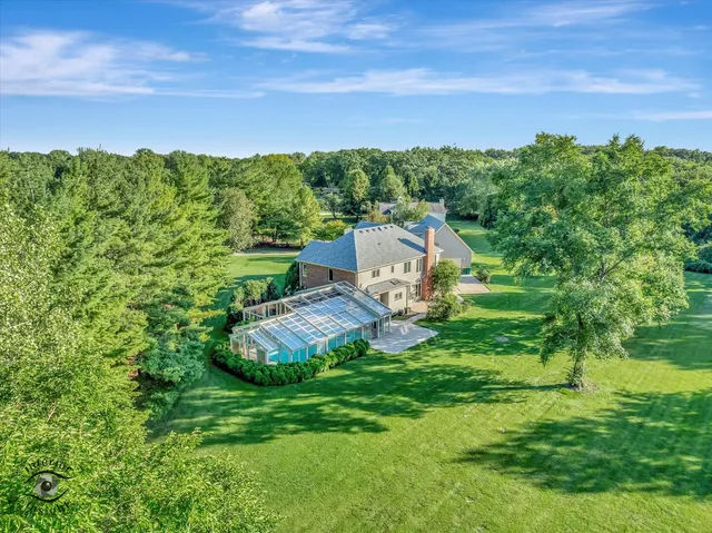 a view of a garden with a building in the background