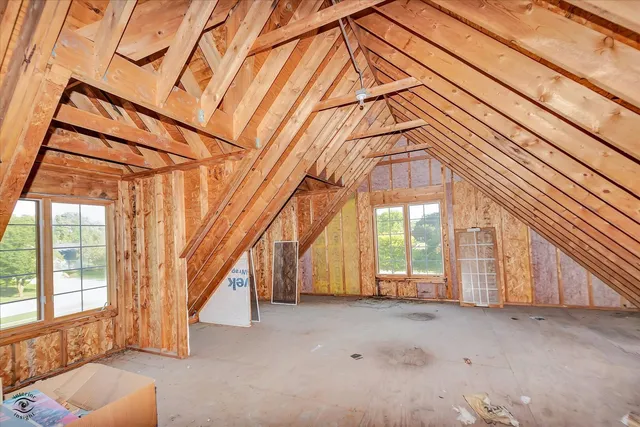 a view of a house with a snow in the yard