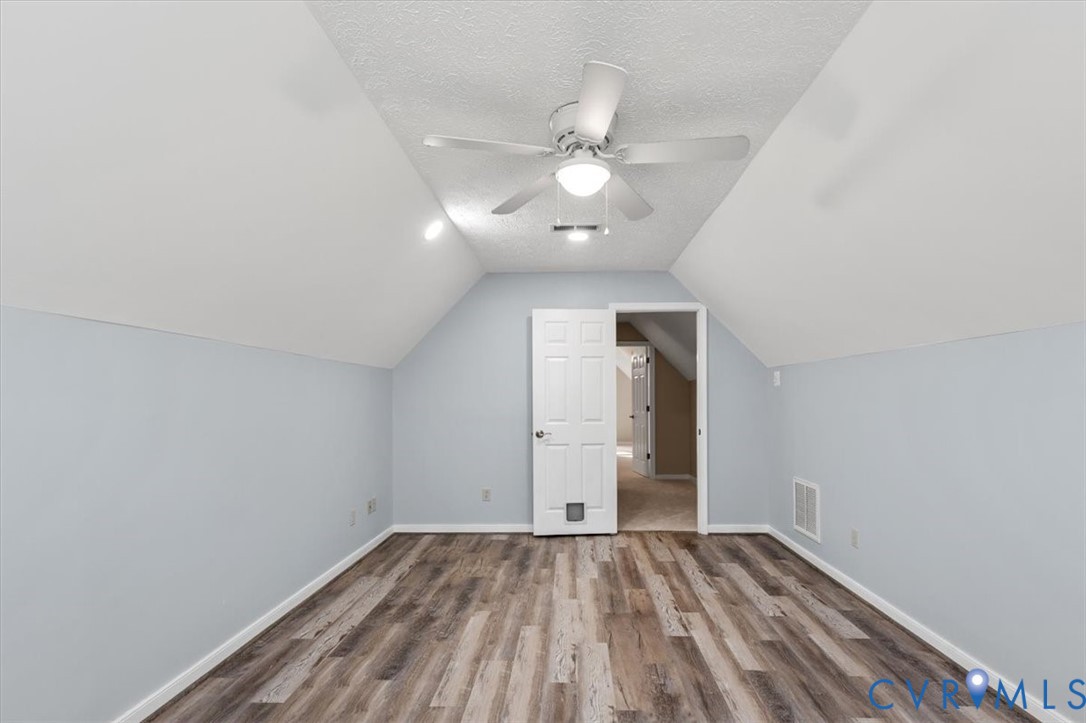 1437 Palmore Road Powhatan, VA 23139 - Photo 36 of 60 Room featuring sloped ceilings, wood-finish floori