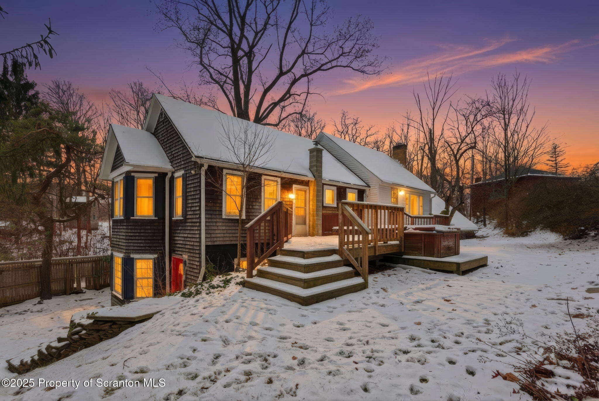 a backyard of a house with barbeque oven and outdoor seating