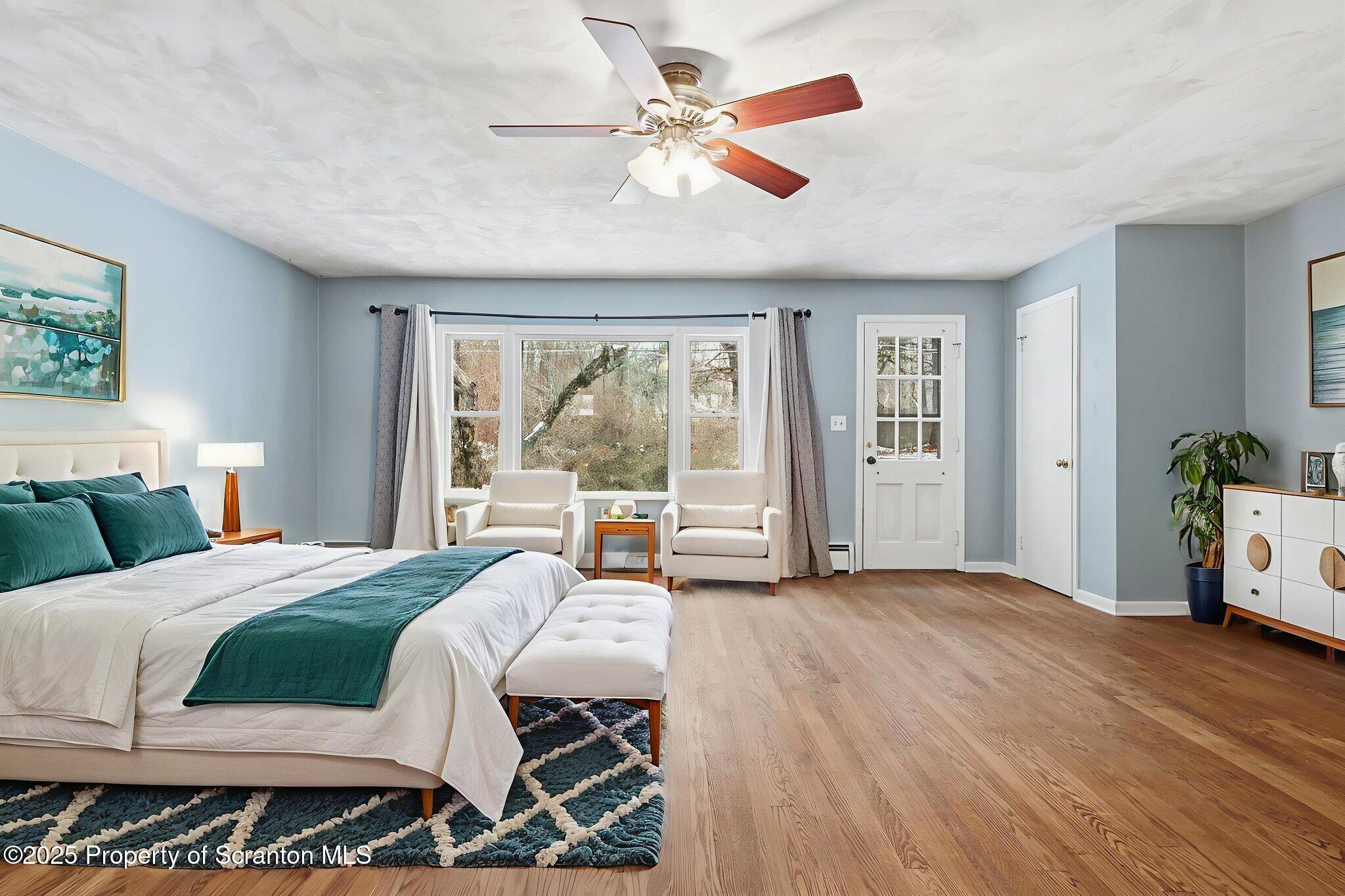 2457 Airport Road Forest City, PA 18421 - Photo 14 of 78 a bedroom with a large bed and a large window