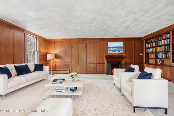 a view of a livingroom with furniture and hardwood floor