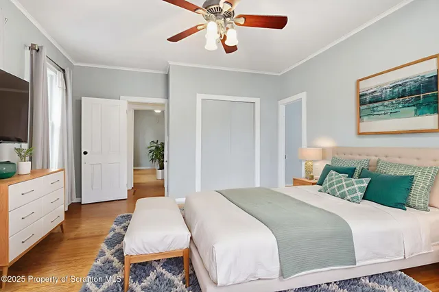 a view of a livingroom with furniture and hardwood floor