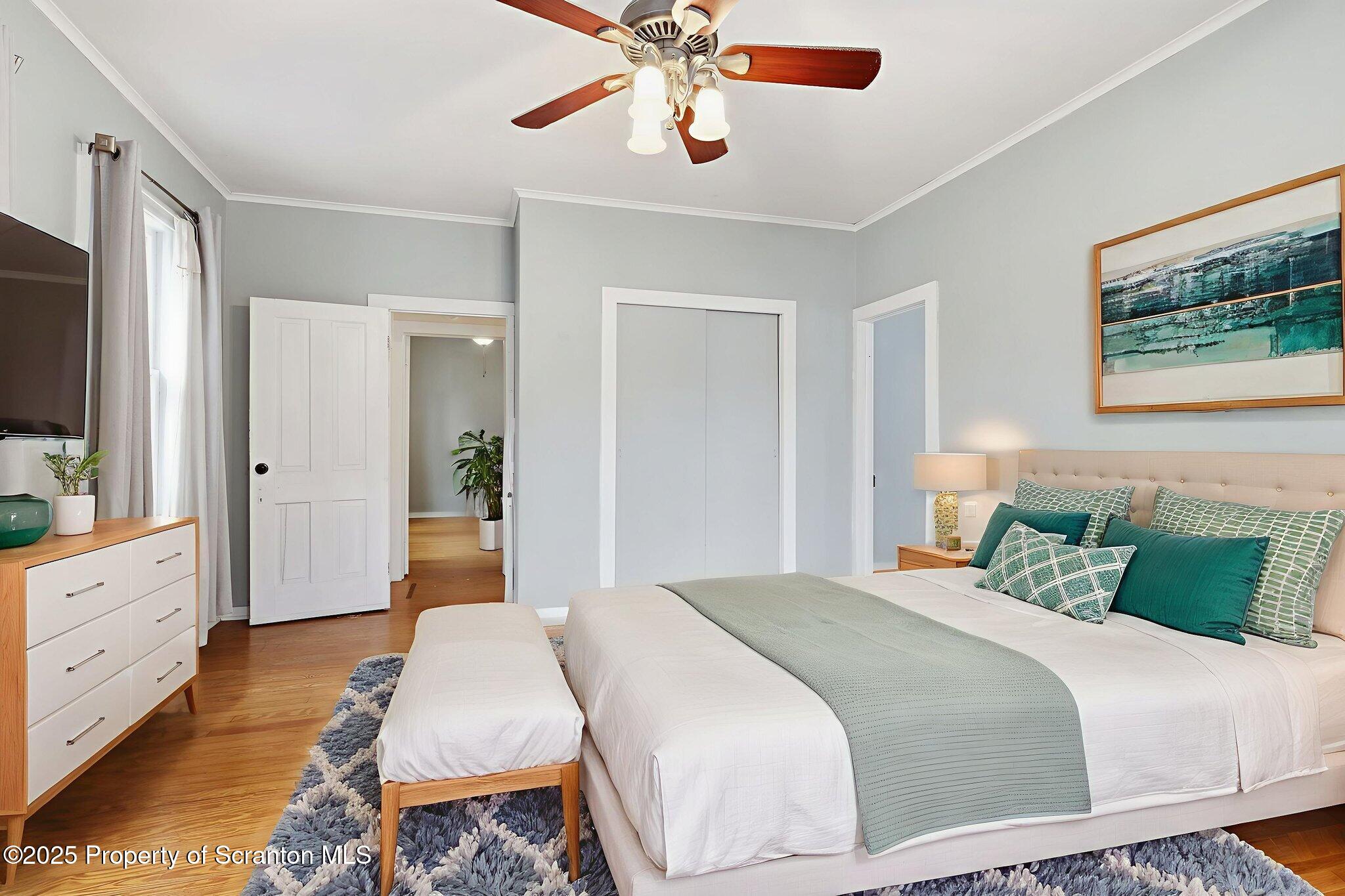 2457 Airport Road Forest City, PA 18421 - Photo 16 of 78 a bedroom with a bed and a chandelier