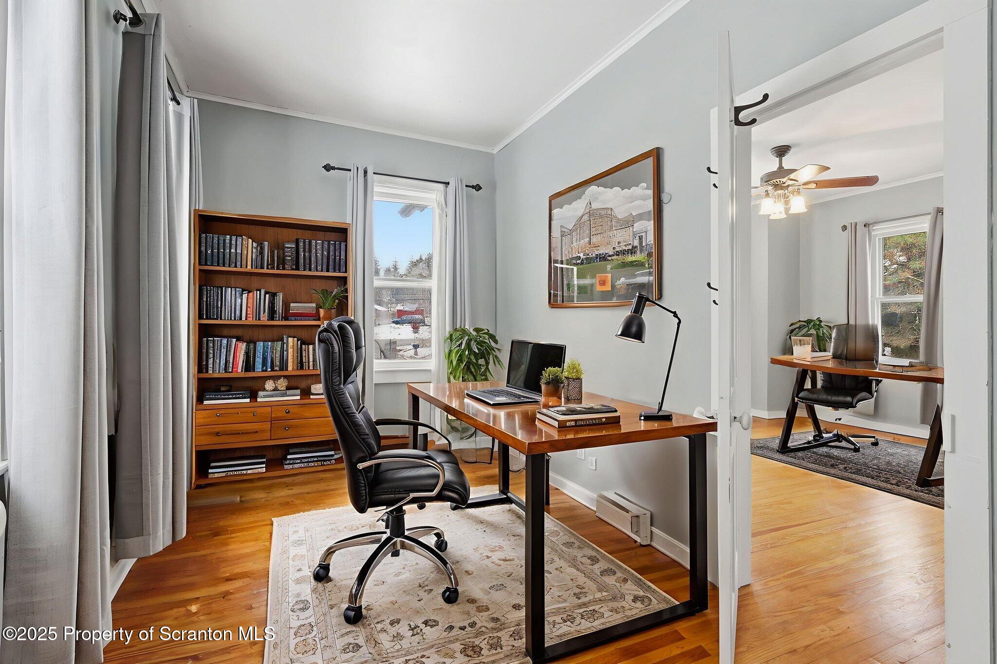 2457 Airport Road Forest City, PA 18421 - Photo 17 of 78 a view of a workspace with furniture and wooden floor