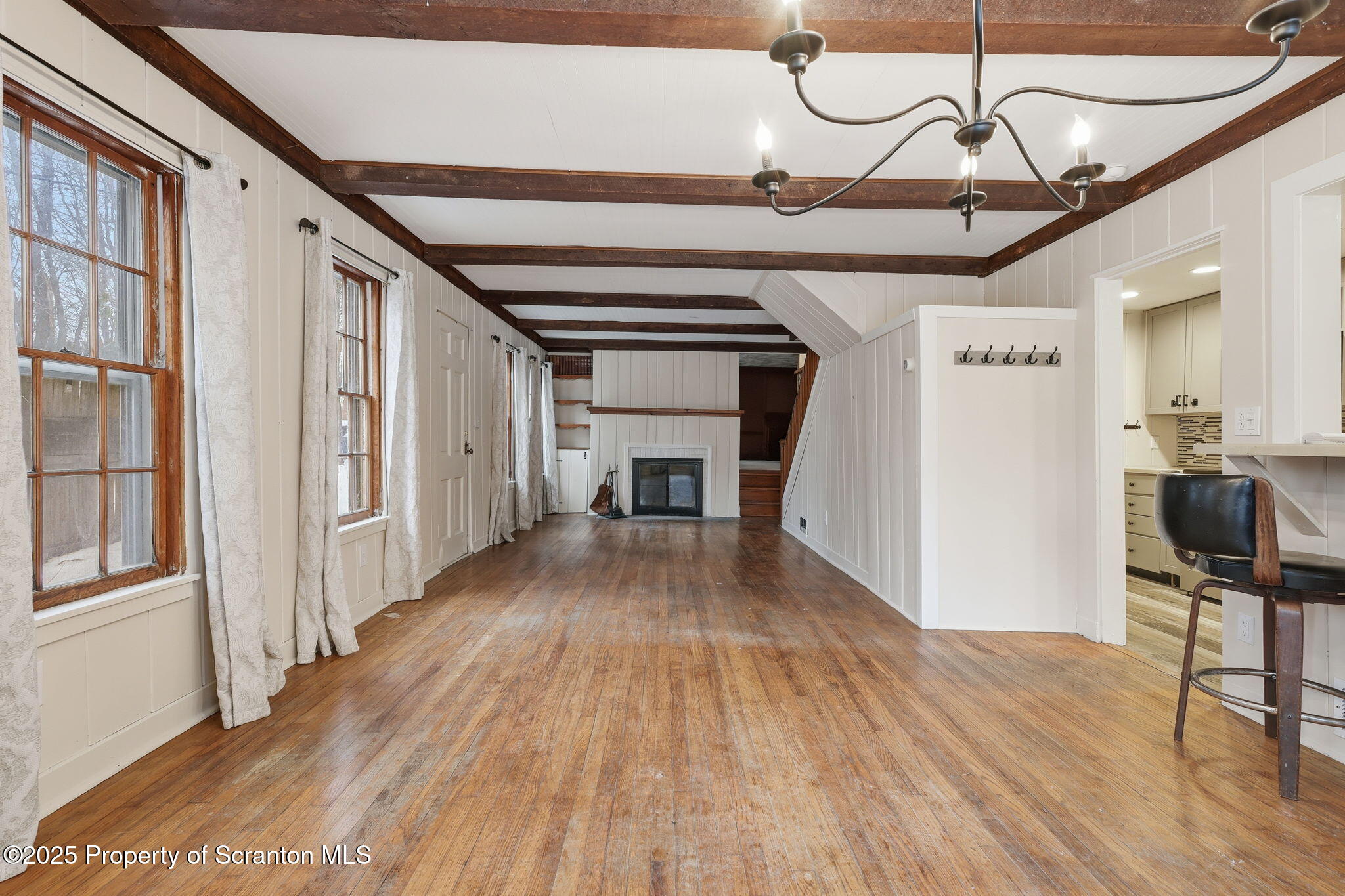 2457 Airport Road Forest City, PA 18421 - Photo 21 of 78 a view of a livingroom with wooden floor and stairs