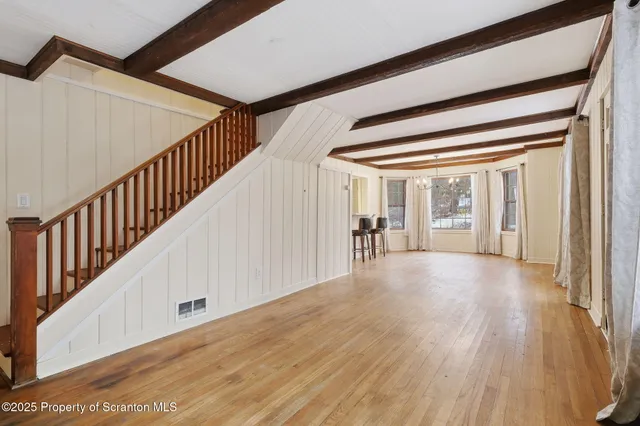 a view of an empty room with closet and garage