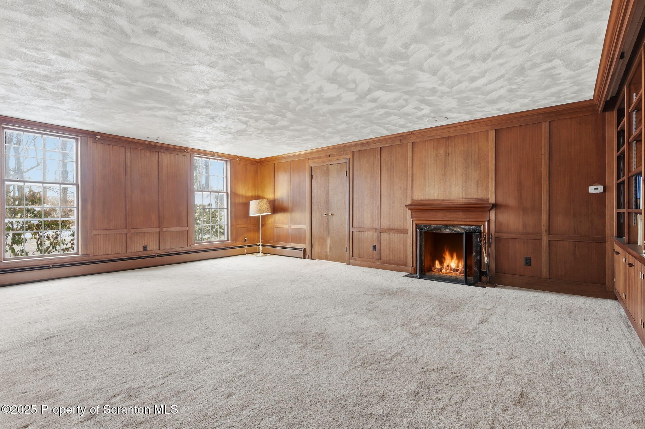 2457 Airport Road Forest City, PA 18421 - Photo 26 of 78 a view of an empty room with a fireplace and a window