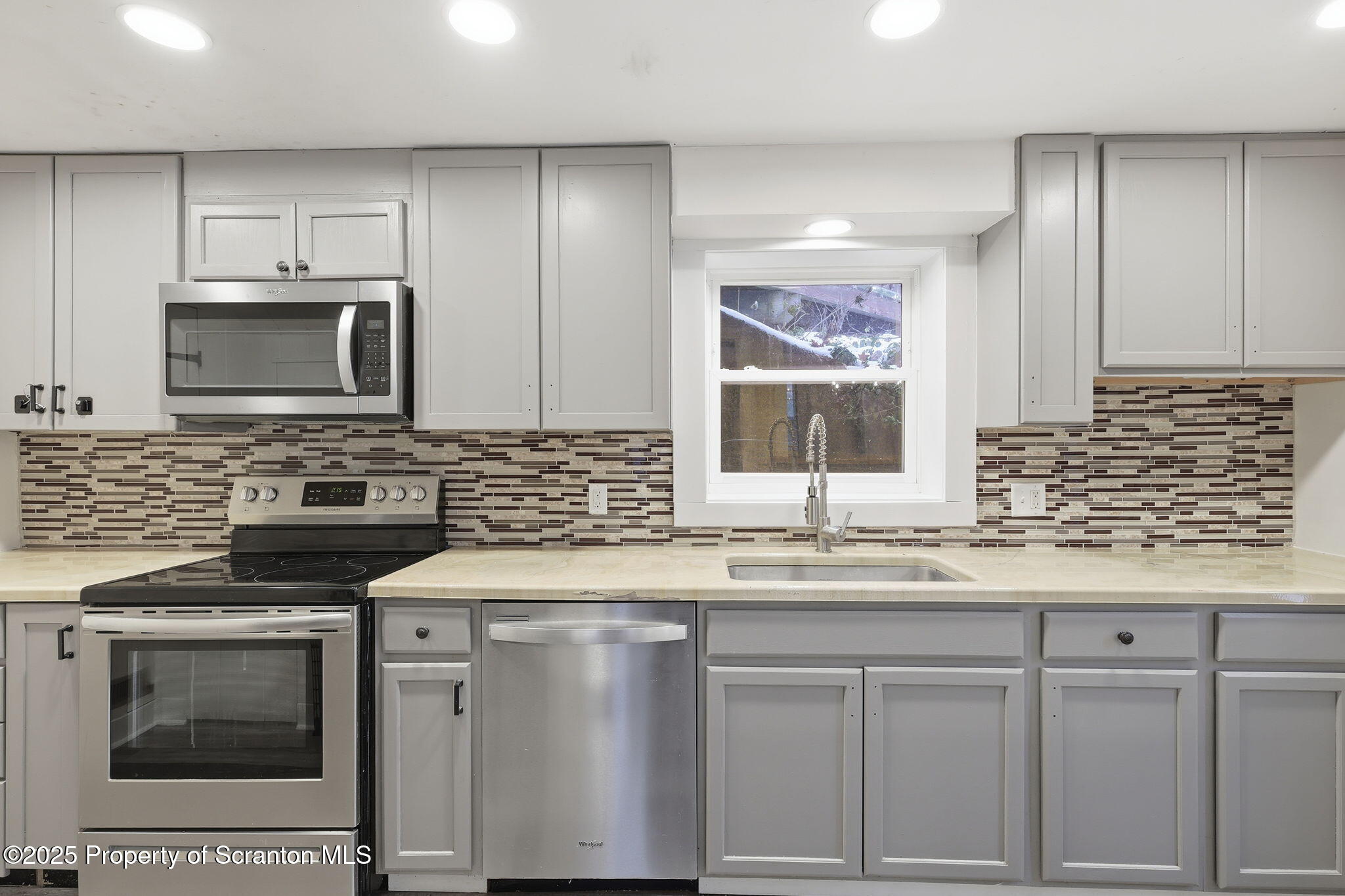 2457 Airport Road Forest City, PA 18421 - Photo 30 of 78 a kitchen with granite countertop a sink stainless steel appliances and cabinets