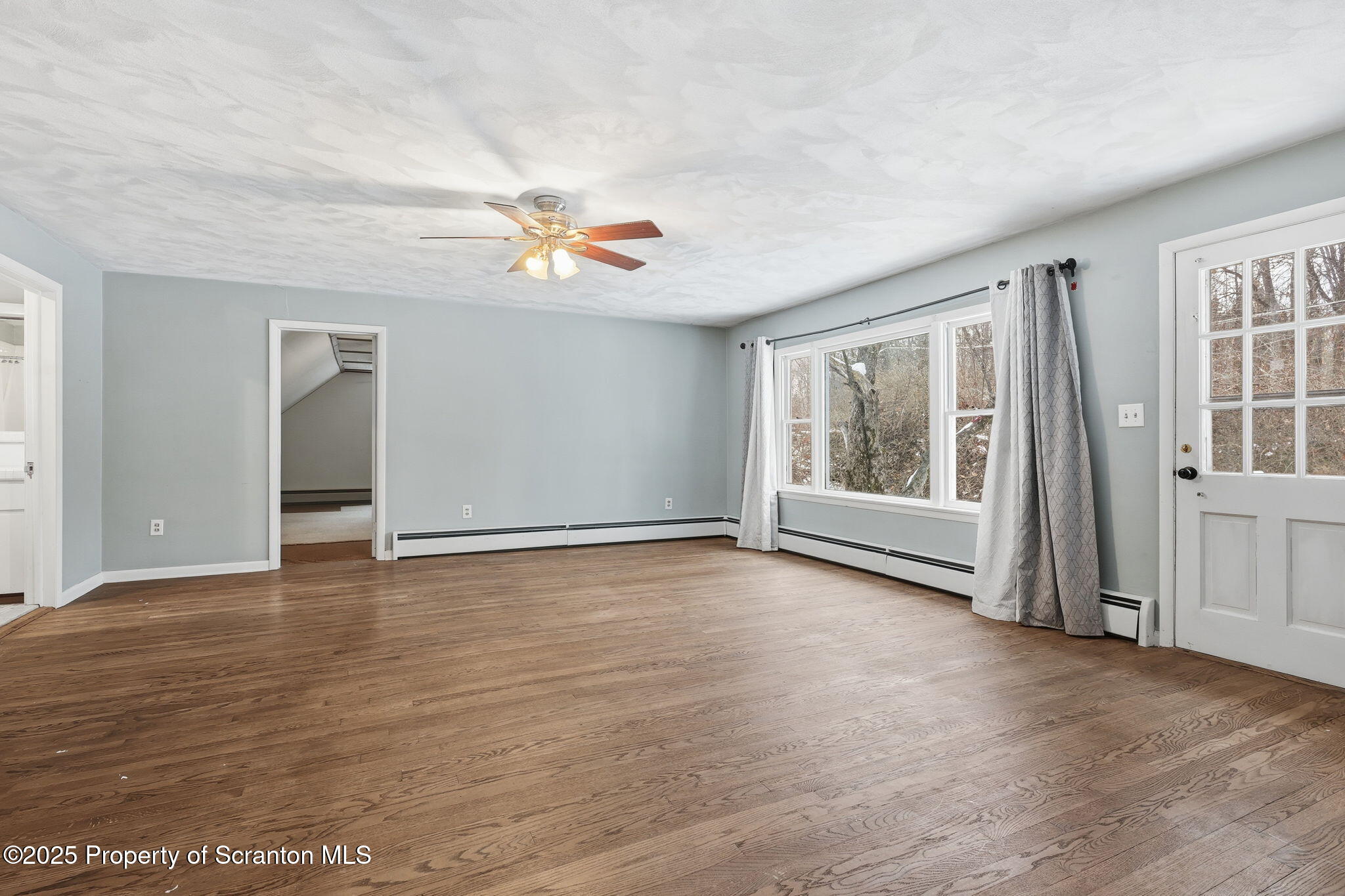 2457 Airport Road Forest City, PA 18421 - Photo 33 of 78 wooden floor in an empty room with a window