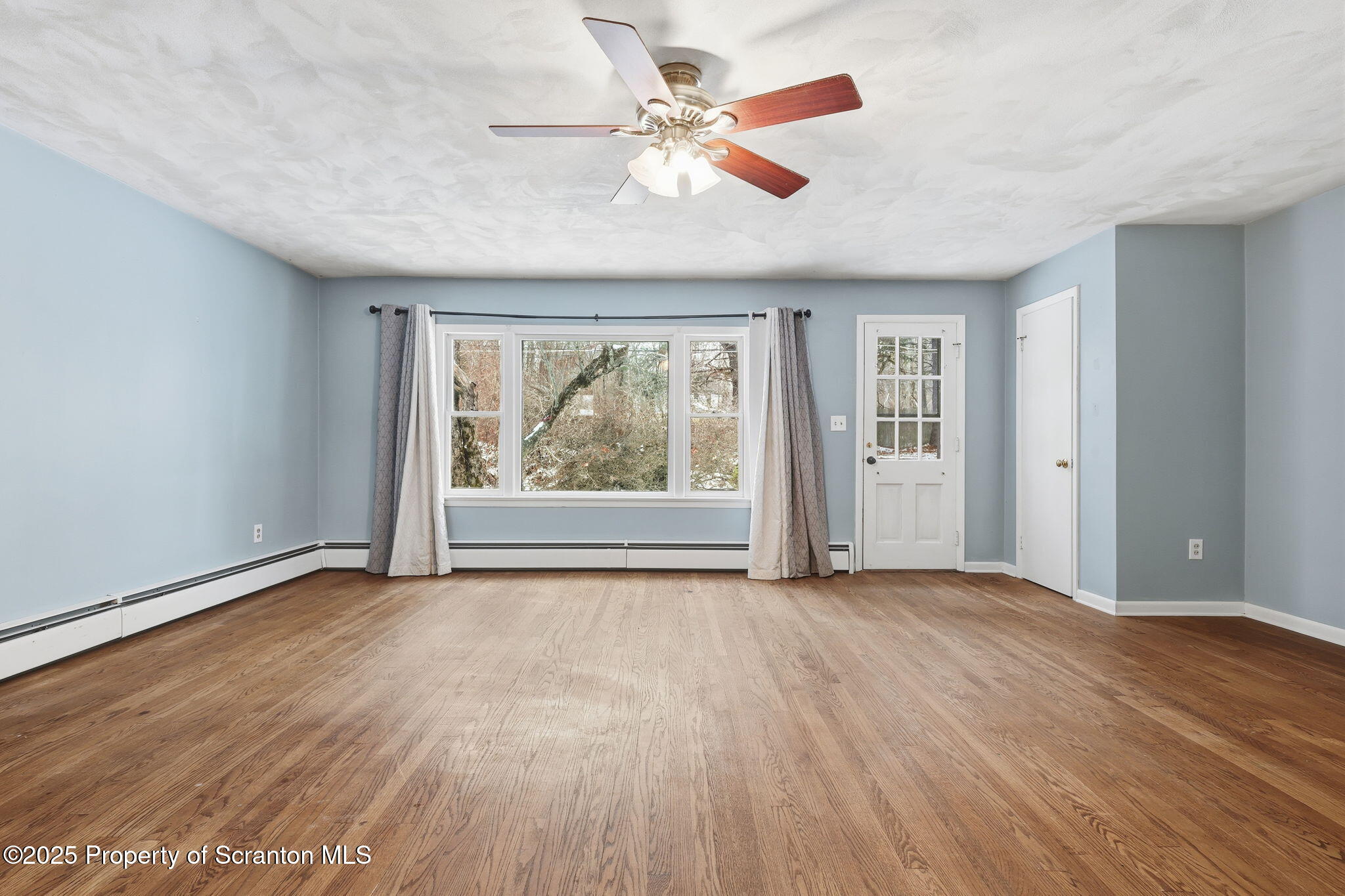 2457 Airport Road Forest City, PA 18421 - Photo 40 of 82 wooden floor in an empty room with a window