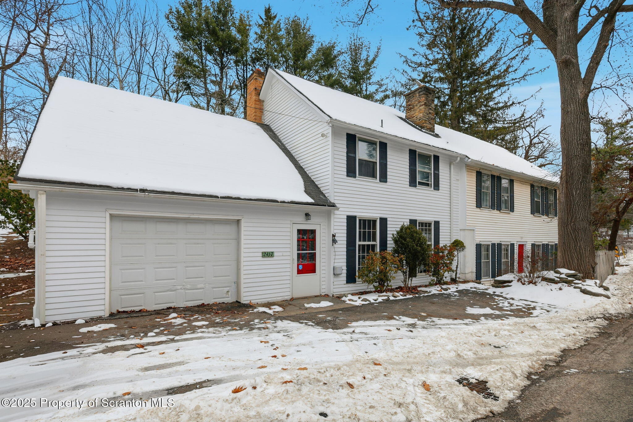 2457 Airport Road Forest City, PA 18421 - Photo 4 of 78 a view of a white house with a snow on the road