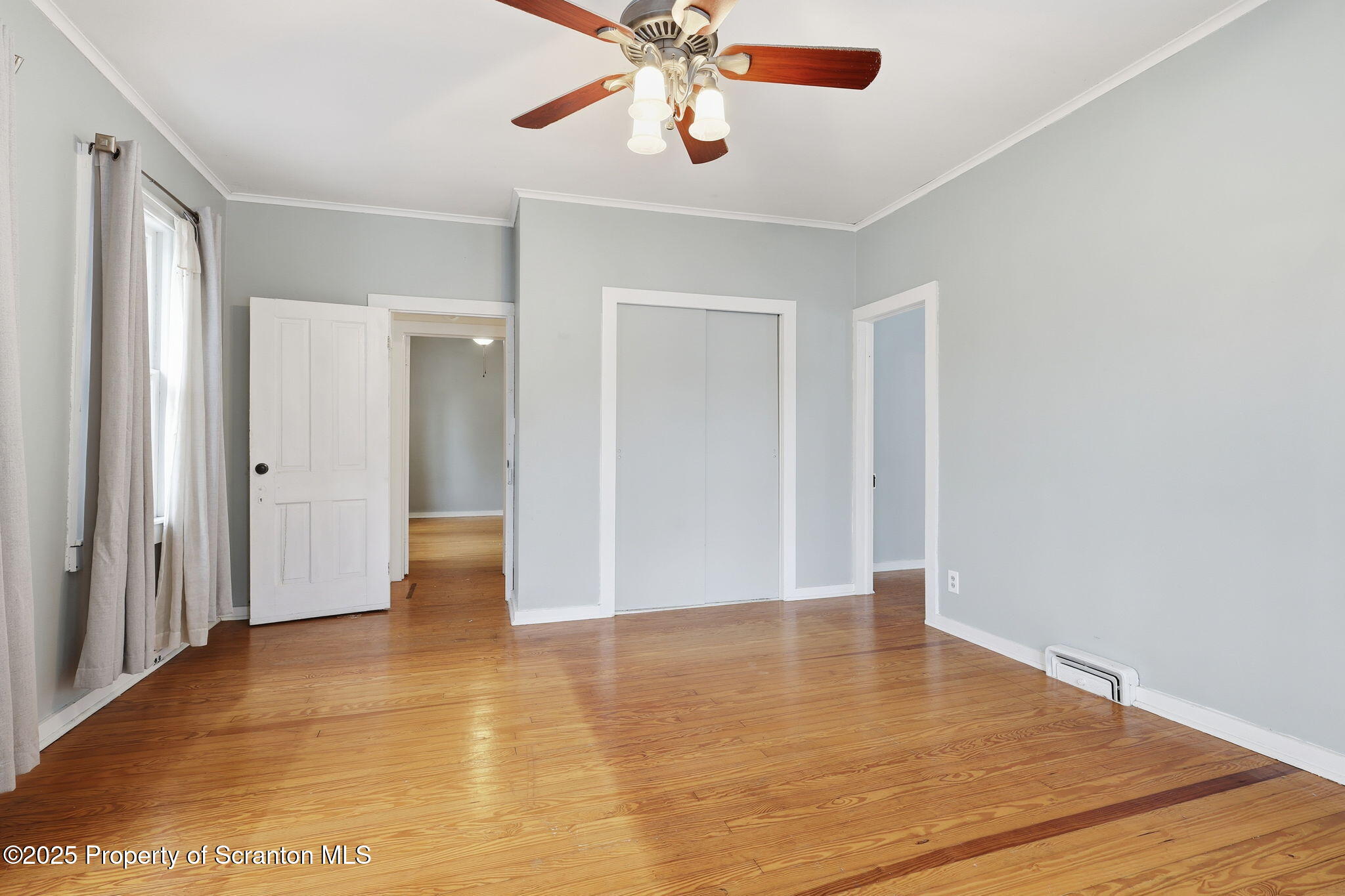 2457 Airport Road Forest City, PA 18421 - Photo 46 of 78 a view of an empty room with chandelier fan and wooden floor
