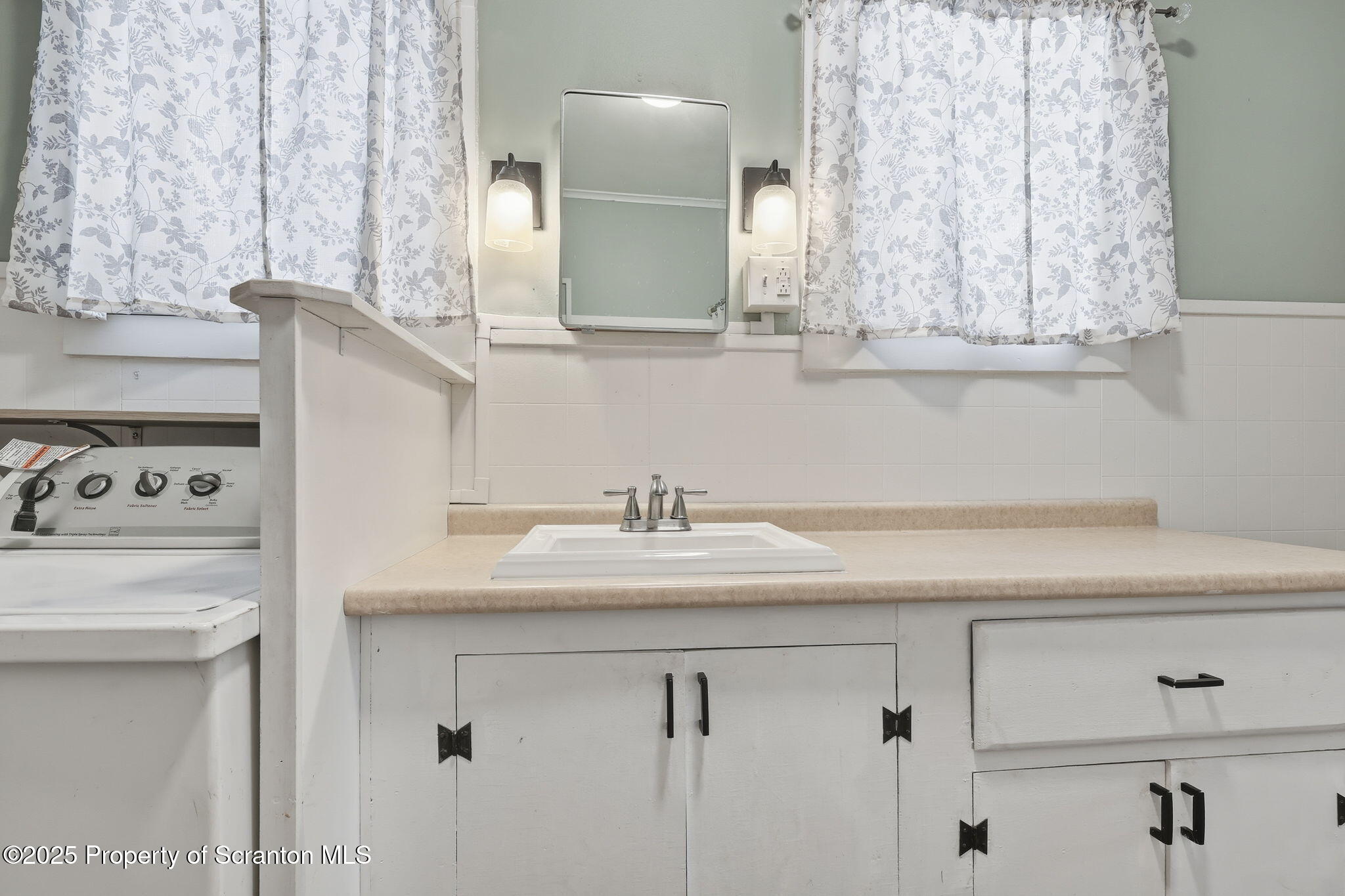 2457 Airport Road Forest City, PA 18421 - Photo 49 of 78 a bathroom with a sink and a mirror