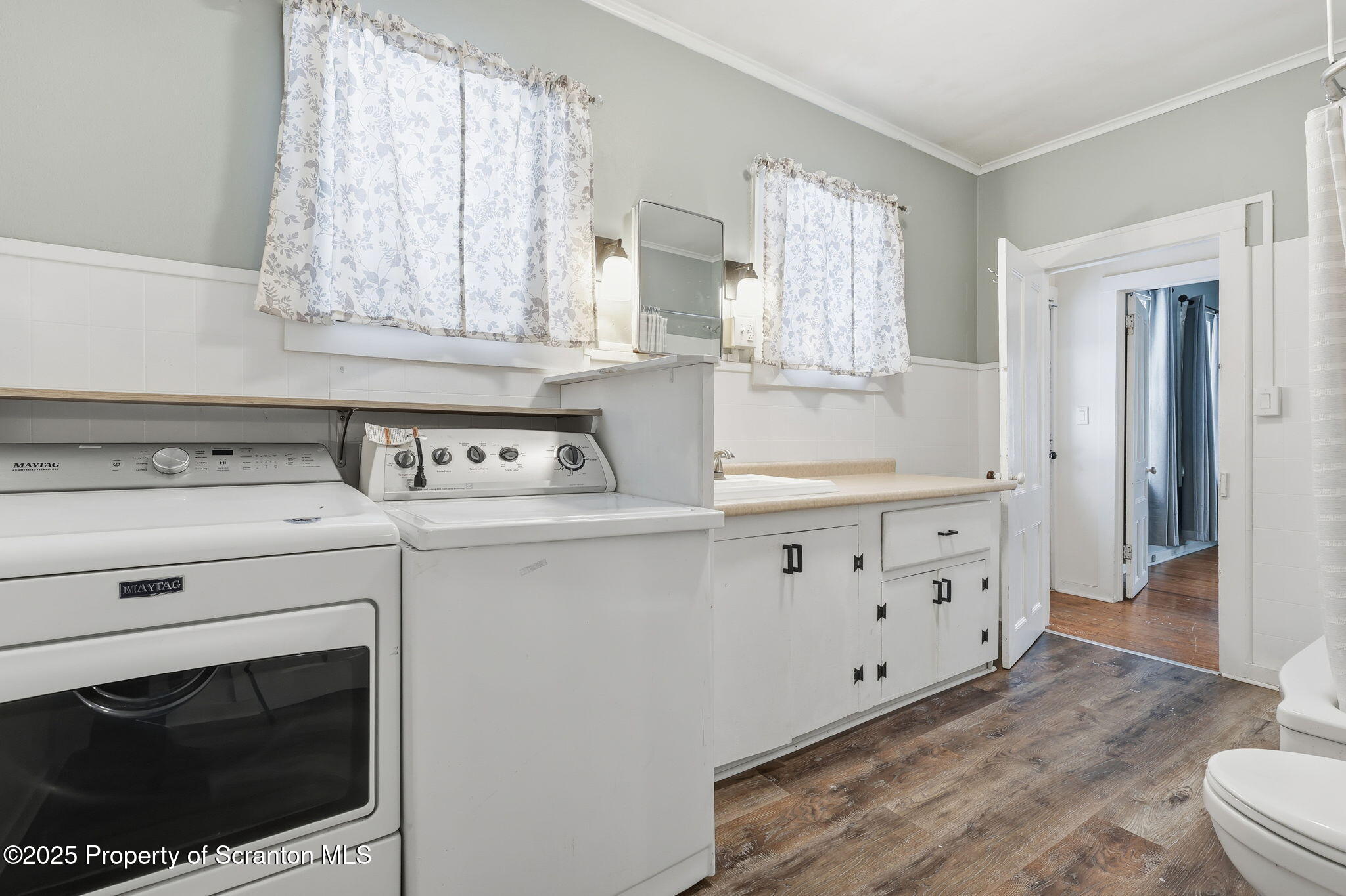 2457 Airport Road Forest City, PA 18421 - Photo 54 of 82 a kitchen with stainless steel appliances white cabinets and a stove