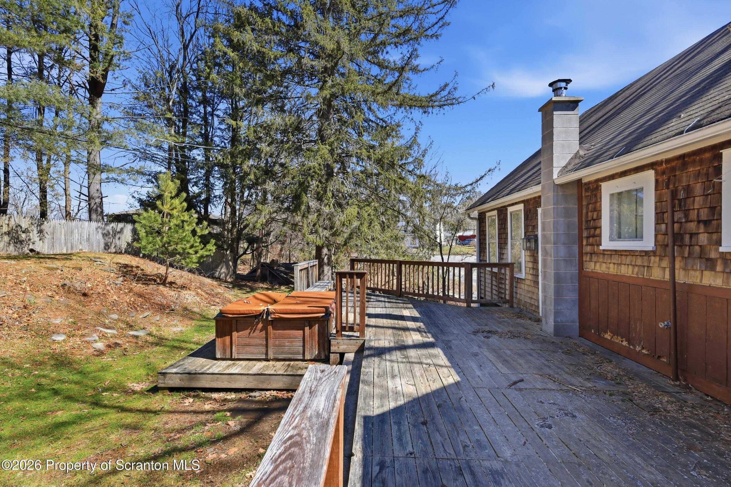 2457 Airport Road Forest City, PA 18421 - Photo 65 of 82 a balcony with wooden floor table and chairs