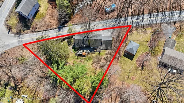 a bedroom with a large bed and a large window