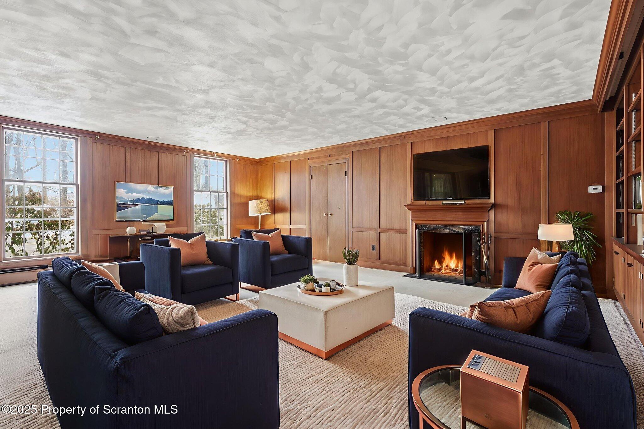2457 Airport Road Forest City, PA 18421 - Photo 9 of 78 a living room with fireplace furniture and a flat screen tv