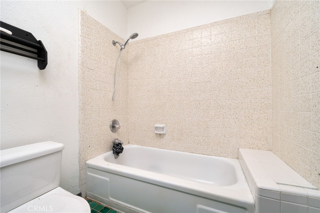 14580 Keota Road Apple Valley, CA 92307 - Photo 23 of 44 a bathroom with a sink a toilet and shower