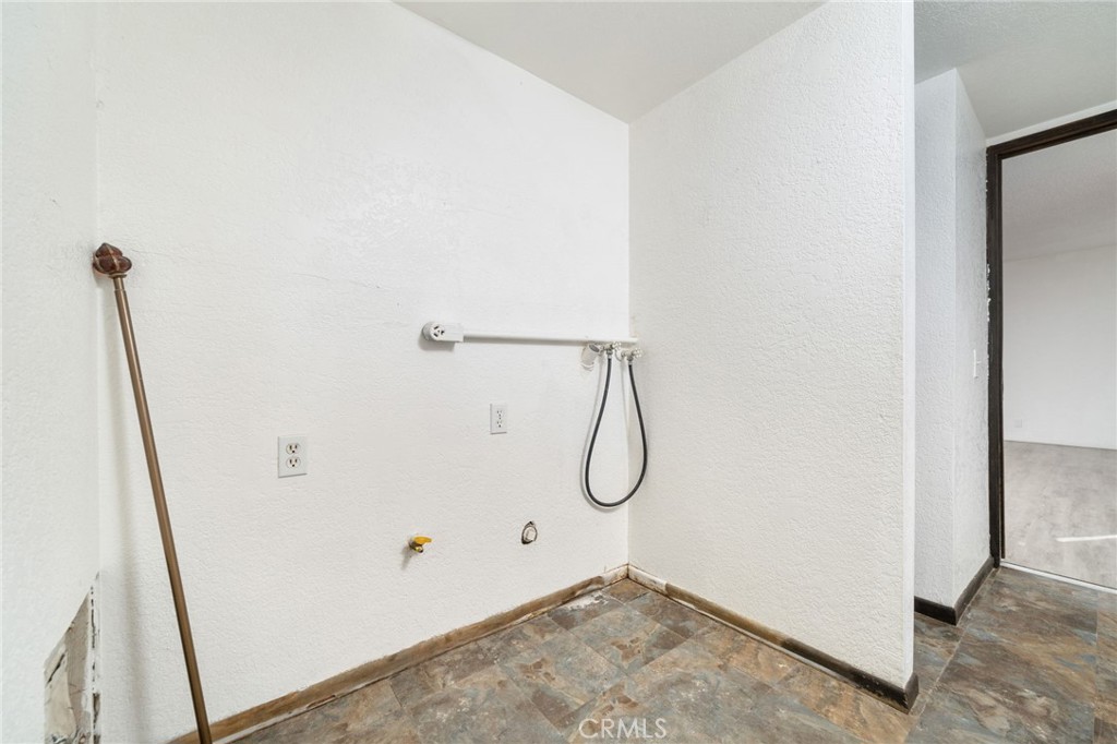 14580 Keota Road Apple Valley, CA 92307 - Photo 27 of 44 a view of a room with rack on the wall