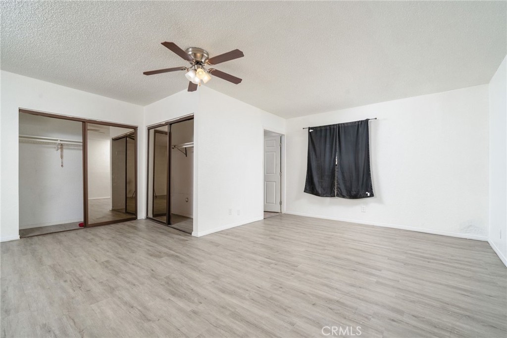 14580 Keota Road Apple Valley, CA 92307 - Photo 29 of 44 a view of an empty room with wooden floor