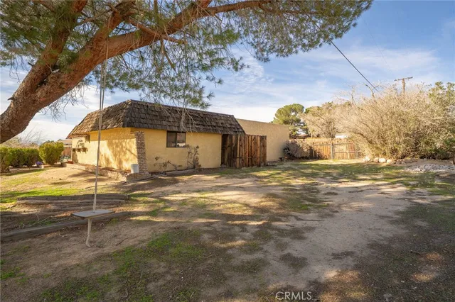 a view of a yard with an outdoor space