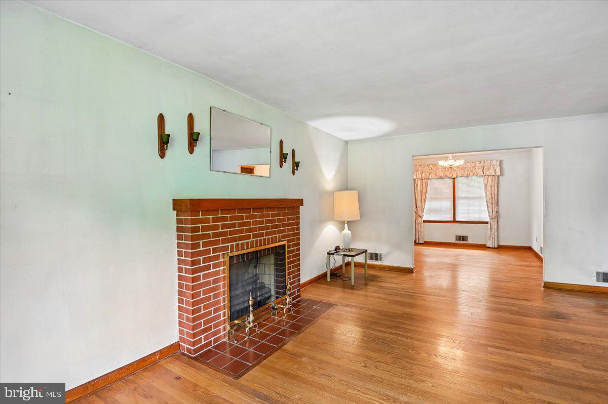1509 Duvall Road Annapolis, MD 21409 - Photo 19 of 39 a living room with furniture and a fireplace
