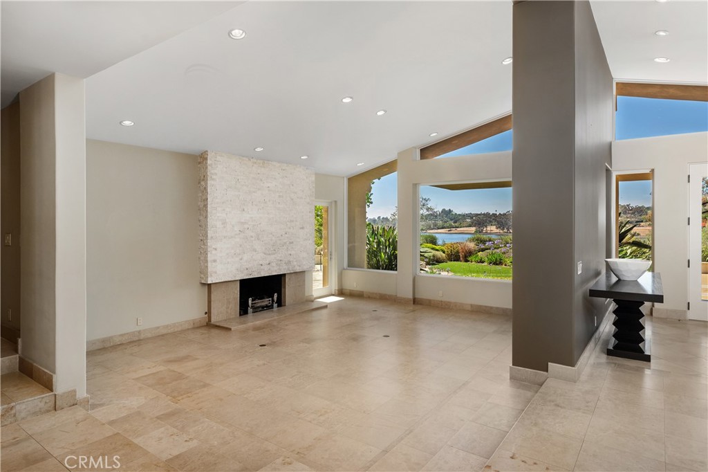 6533 Lago Lindo Rancho Santa Fe, CA 92067 - Photo 15 of 57 a view of an empty room with furniture and a fireplace