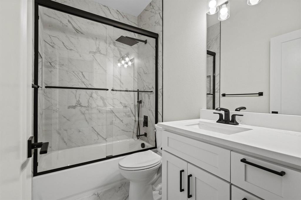 4605 Dripping Spring Road Sherman, TX 75090 - Photo 30 of 40 a bathroom with a sink toilet and shower