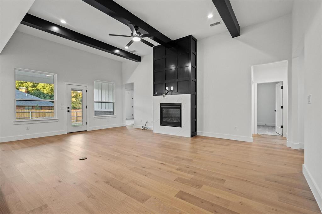 4605 Dripping Spring Road Sherman, TX 75090 - Photo 7 of 40 an empty room with windows and fireplace