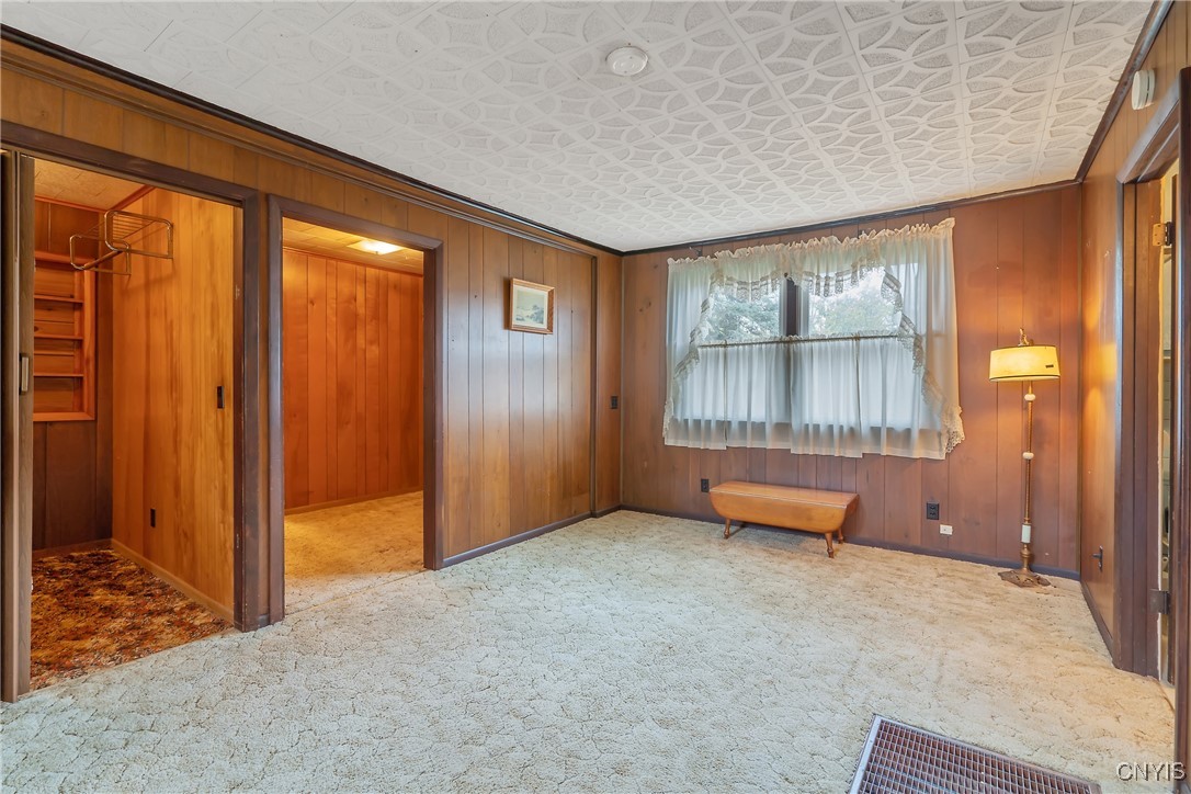 8392 Tuttle Road Bridgeport, NY 13030 - Photo 11 of 32 At the center of the house, the living room is tru