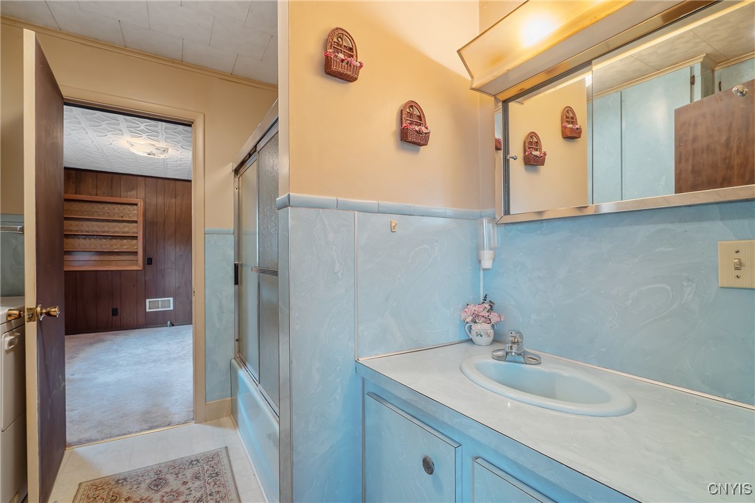 8392 Tuttle Road Bridgeport, NY 13030 - Photo 12 of 32 An oversized vanity countertop with storage and me