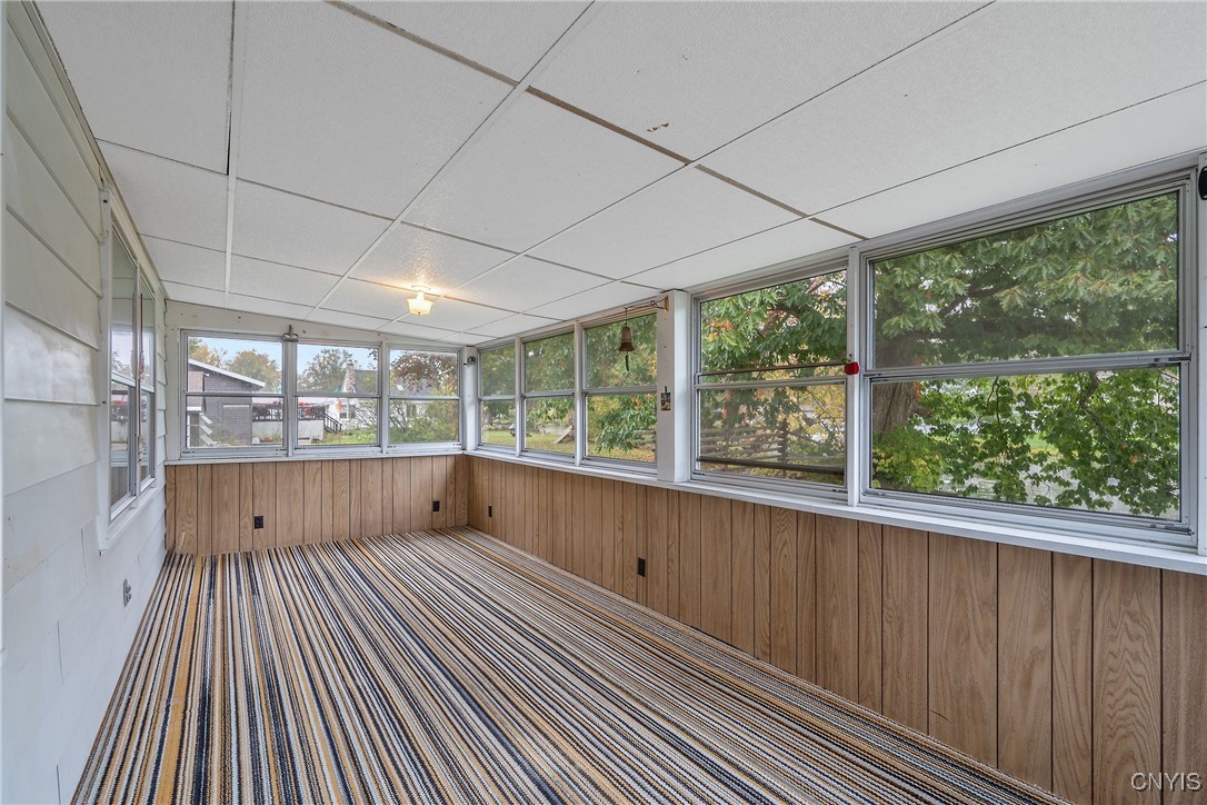 8392 Tuttle Road Bridgeport, NY 13030 - Photo 22 of 32 Outside of the primary bedroom is the enclosed 3-s