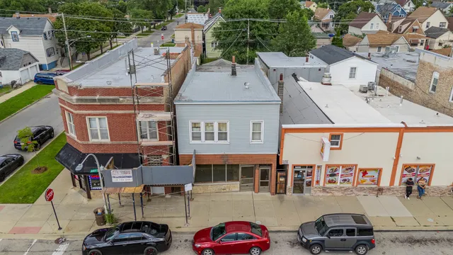 an aerial view of a house with parking space